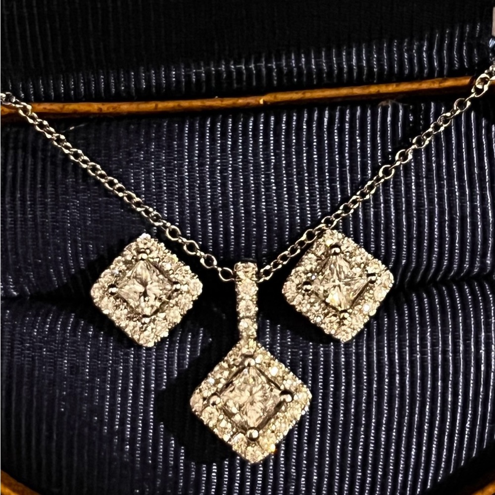 Matching Leo Diamond 14K white gold diamond earrings and diamond pendant set.